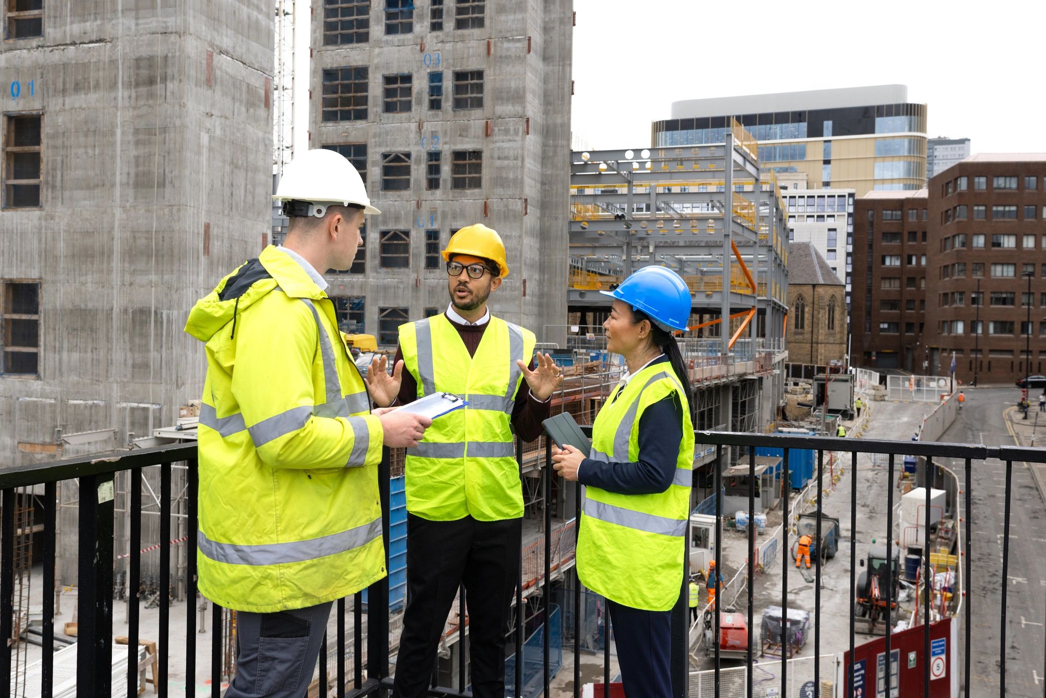 Engineering team reviewing plans at an infrastructure site